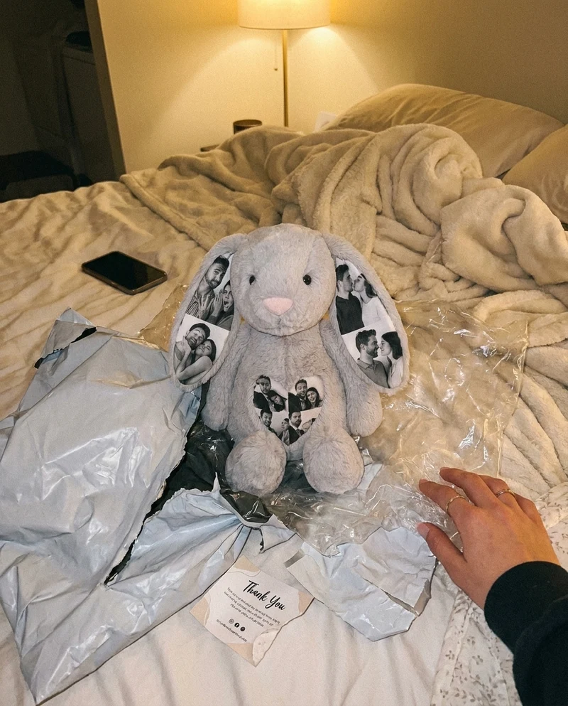 Customer holding her pink personalised photo bunny at home